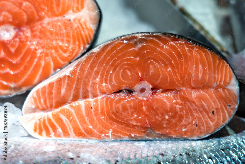 Raw norwegian fish salmon at the fish market close-up. Healthy eating red salmon fish Raw norwegian fish salmon at the fish market close-up. Healthy eating red salmon fish