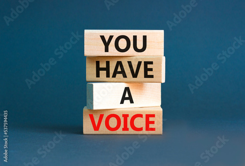 You have a voice symbol. Concept words You have a voice on wooden blocks. Beautiful grey table grey background. Business, psychological you have a voice concept. Copy space.