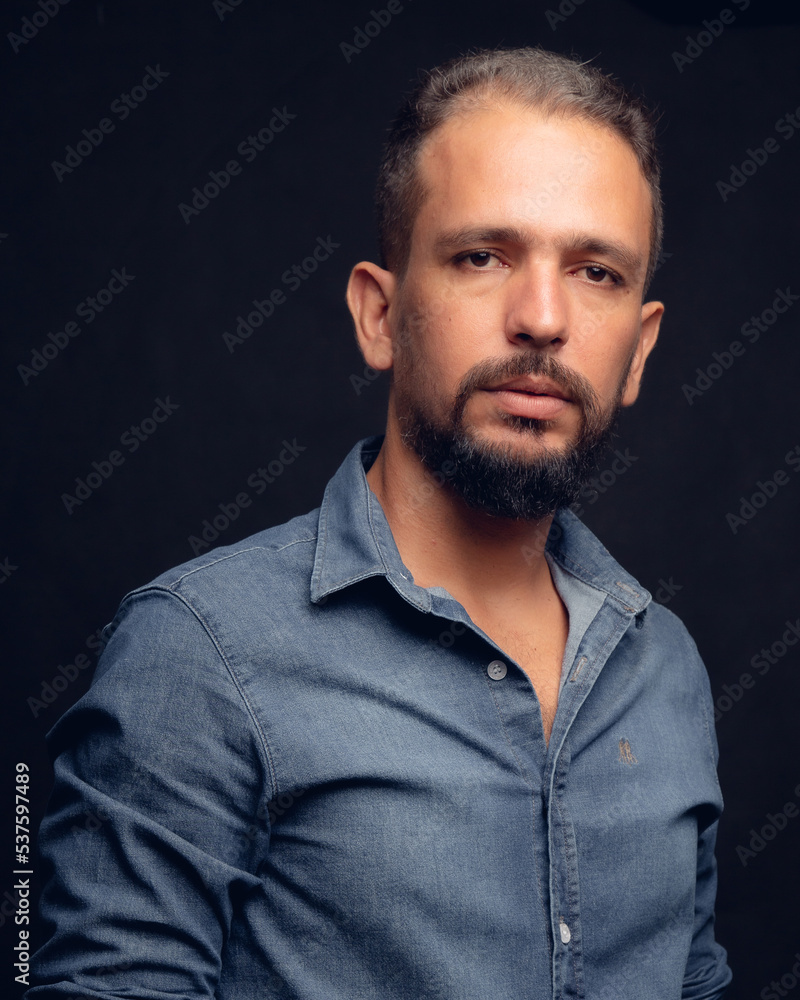 Serious white man, in studio, gray hair