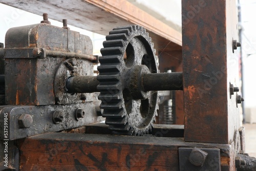 The toothed wheel is part of the drive transmission in the old  manual mangle.