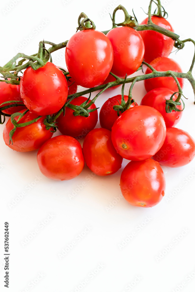 Cherry tomatoes. ripe red cherry tomatoes. lie on a white background Cherry tomatoes. ripe red cherry tomatoes. lie on a white background