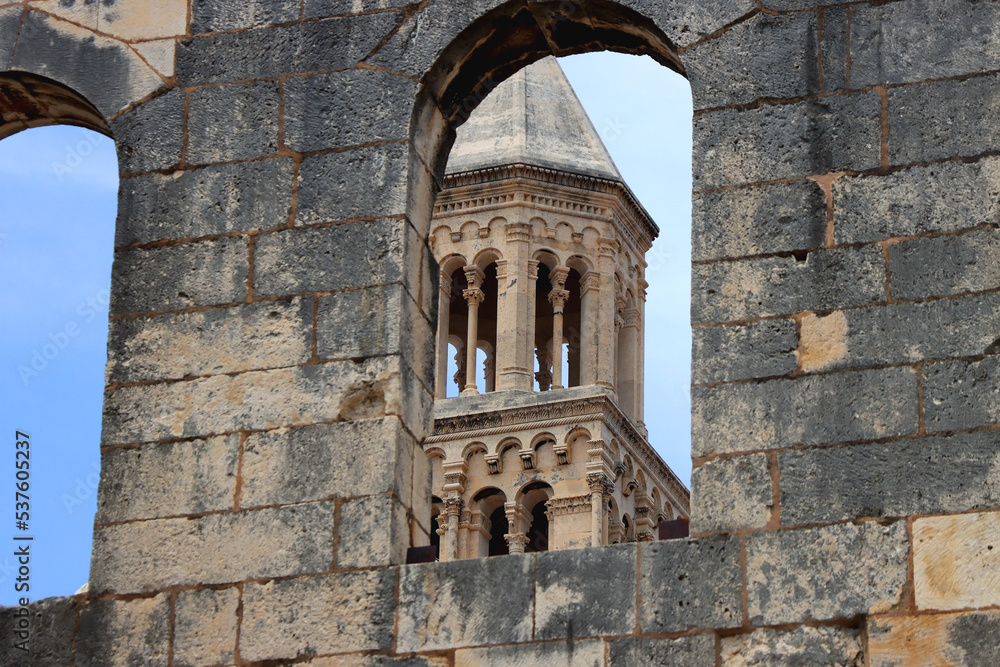 Saint Domnius tower seen through The Silver Gate. Historical landmarks in Split, Croatia. Selective focus. Saint Domnius tower seen through The Silver Gate. Historical landmarks in Split, Croatia. Selective focus.