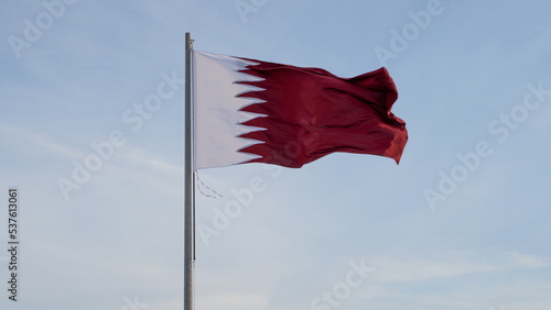 qatar flag flying high in the wind..