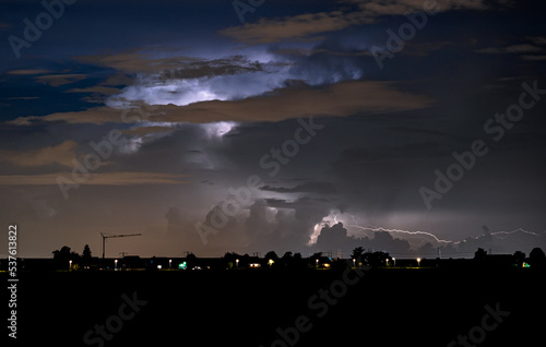 Thunderstorm is illuminated by flashes of lightning