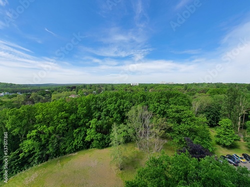 Aerial view of the beautiful green landscape with forested hillside photo