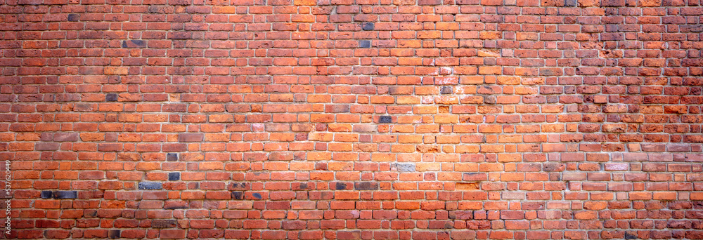 Naklejka premium Mur z czerwonej cegły, zdjęcie w układzie panoramicznym, panorama, tekstura