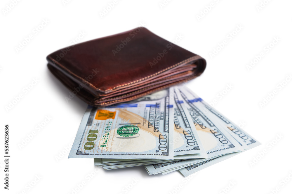 Pile of new design US dollar bills in brown wallet isolated on white background. Hundreds of dollar cash banknotes. Selective focus. Business, finance, bank, currency, economy, wealth concept Pile of new design US dollar bills in brown wallet isolated on white background. Hundreds of dollar cash banknotes. Selective focus. Business, finance, bank, currency, economy, wealth concept