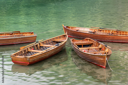 Wooden boats on the lake Braies. Tourist  famous place in the Dolomites. Italy. Beautiful nature. Beautiful places. A means of transportation. Logo di Braies.Pragser Wildersee