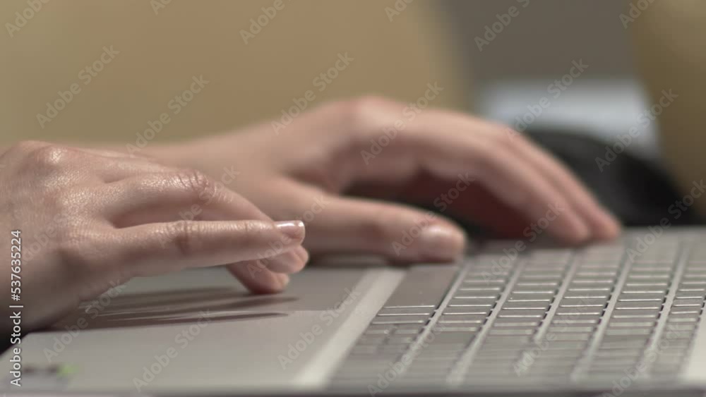 Woman's hands typing on laptop's keyboard. Woman as IT developer working and typing code on the laptop at home. Remote working during pandemic concept. Selective focus Woman's hands typing on laptop's keyboard. Woman as IT developer working and typing code on the laptop at home. Remote working during pandemic concept. Selective focus