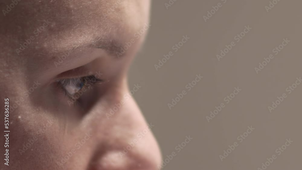 Closeup of woman's eyes while surfing online on the internet on the laptop Closeup of woman's eyes while surfing online on the internet on the laptop