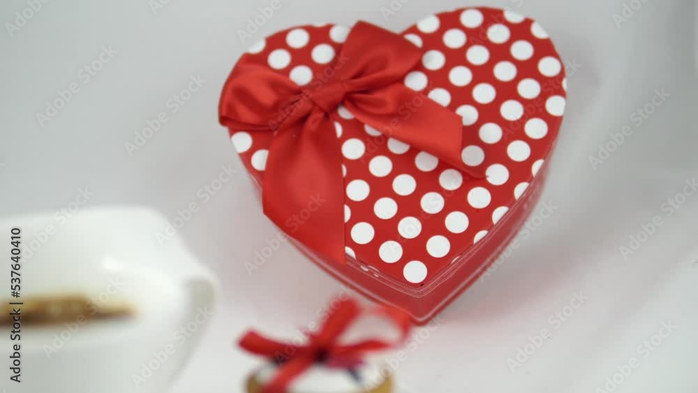 Red romantic decorated cookies and a red coffee mug, isolated on white. Valentine's Day concept Red romantic decorated cookies and a red coffee mug, isolated on white. Valentine's Day concept