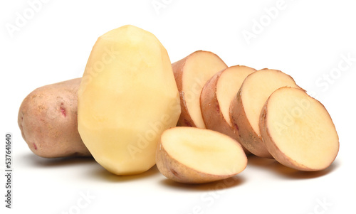 potatoes close-up  raw and sliced  objects are isolated on a white background