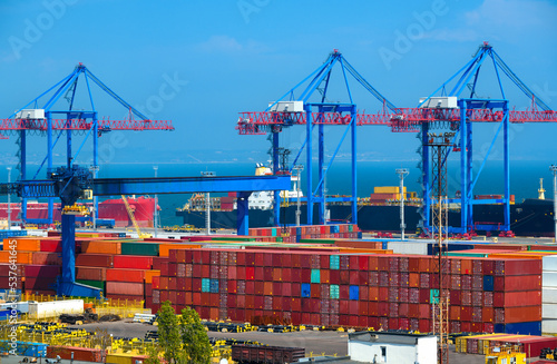 industrial seaport infrastructure, commercial dock and container warehouse, sea, cranes and cargo ship, concept of sea cargo transportation