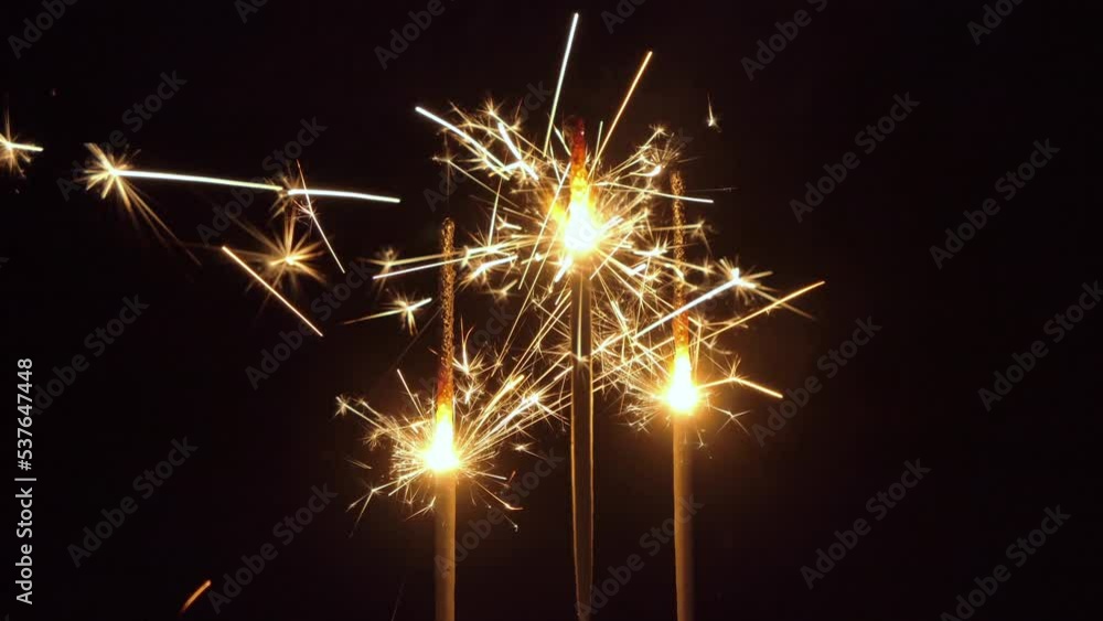 burning Christmas sparklers and sparks burning Christmas sparklers and sparks