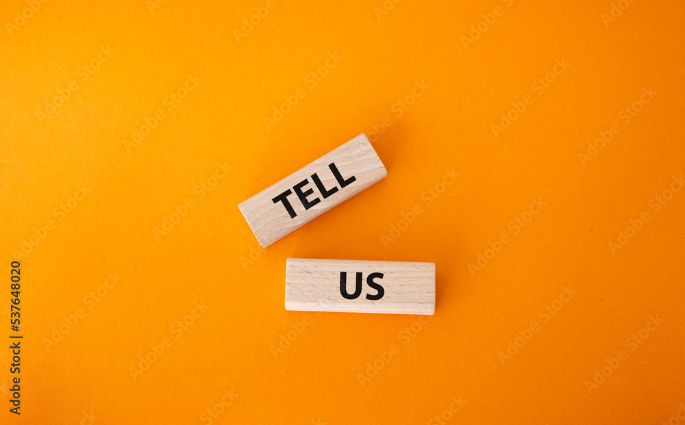 Tell us symbol. Concept words Tell us on wooden blocks. Beautiful orange background. Business and Tell us concept. Copy space. Tell us symbol. Concept words Tell us on wooden blocks. Beautiful orange background. Business and Tell us concept. Copy space.