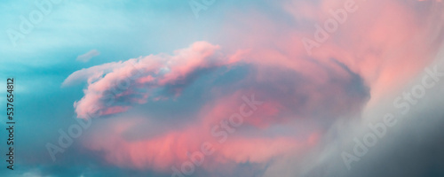 Fotografie Swirling cloud wave bright blue and pink