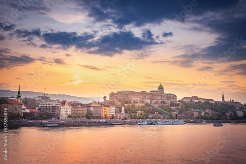 Danube River view of the Buda Castle at dramatic sunset, Budapest, Hungary © Aide