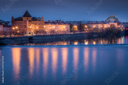 Prague old town and Vltava river illuminated at peaceful dawn, Czech Republic