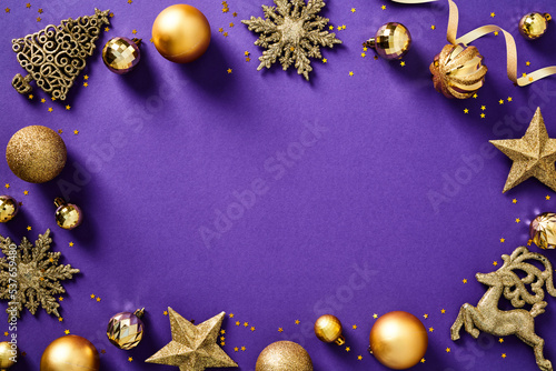 Christmas frame. Golden Xmas decorations on purple background. Luxury Christmas card design, New Year cover template.