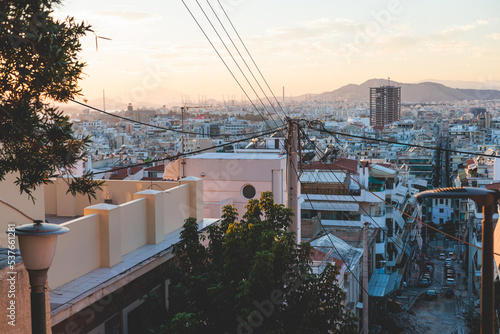 Piraeus city, Attica, beautiful panoramic view of Piraeus, Greece, with harbour and port, mountains and scenery beyond the city, seen from Prophet Helias Hill on Kastela Hill, sunset summer view photo