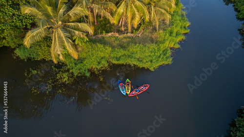 Photos Kayaking tropical island with palm trees and water - Aerial image