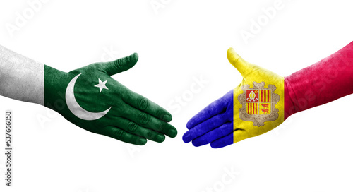 Handshake between Andorra and Pakistan flags painted on hands, isolated transparent image.