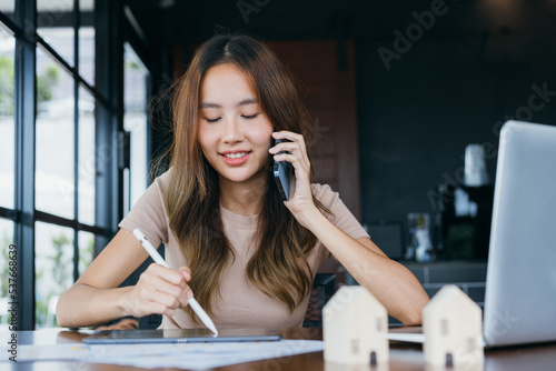 Freelance Freelancer asian woman smiling her working with laptop computer and smartphone for working job at workspace. small business with freedom lifestyle concept.