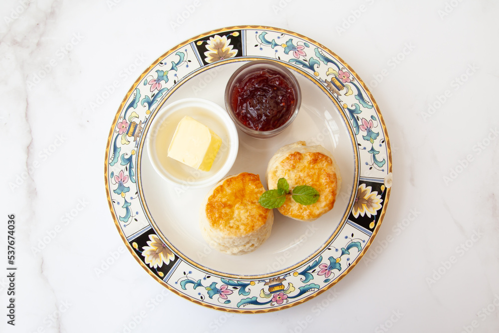 Butter scone set with raspberry and clotted cream Butter scone set with raspberry and clotted cream