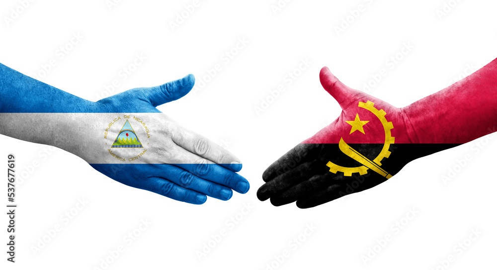 Handshake between Angola and Nicaragua flags painted on hands, isolated transparent image. Handshake between Angola and Nicaragua flags painted on hands, isolated transparent image.