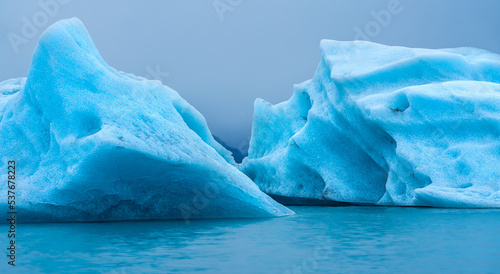blue iceberg in polar regions in the sea