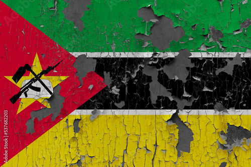 3D Flag of Mozambique on an old stone wall background.