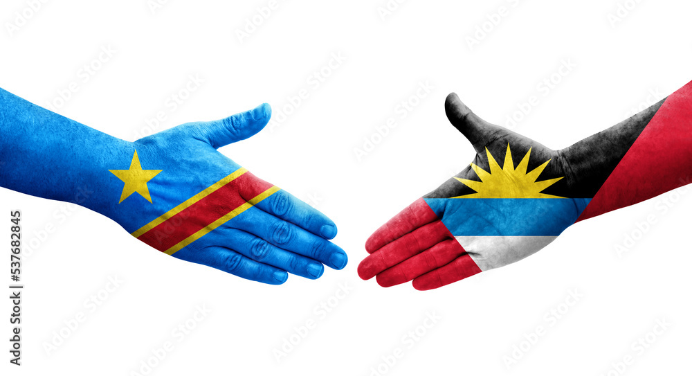 Handshake between Antigua and Barbuda and Dr Congo flags painted on hands, isolated transparent image. Handshake between Antigua and Barbuda and Dr Congo flags painted on hands, isolated transparent image.