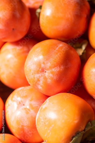 Ripe persimmon fruit background.Close up of fresh kaki