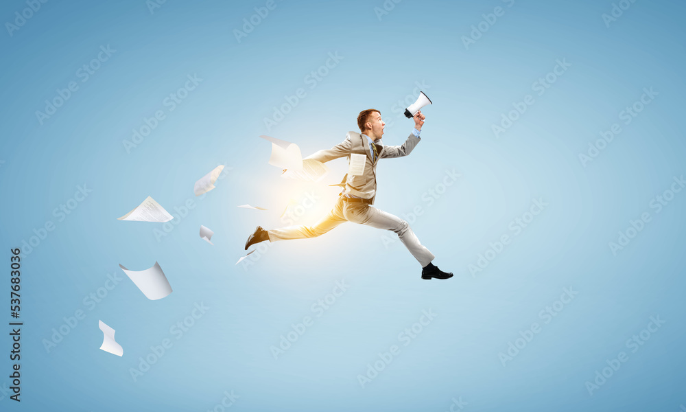 Portrait of energetic businessman jumping in open air Portrait of energetic businessman jumping in open air