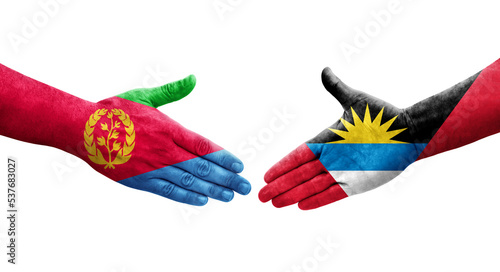 Handshake between Antigua and Barbuda and Eritrea flags painted on hands, isolated transparent image.