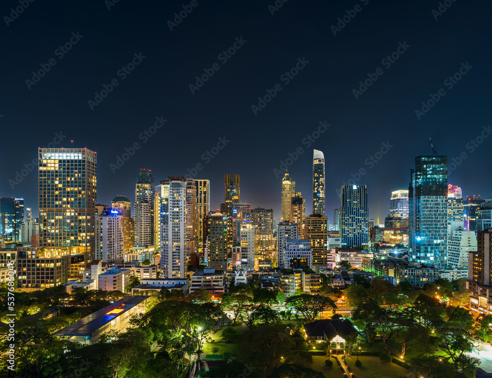 buildings near Witthayu road at night in Bangkok city, Thailand.