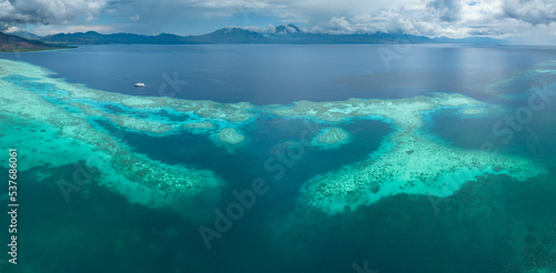 A healthy coral reef thrives off the Pulau Besar north of Flores, Indonesia. This region is known for its high marine biodiversity and spectacular scuba diving and snorkeling.