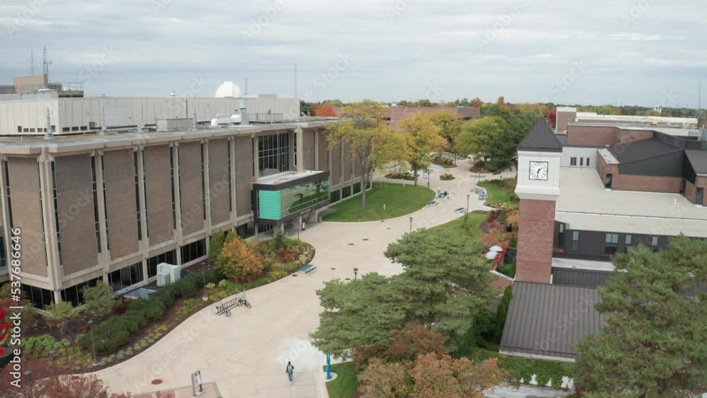Lansing Community College campus in Lansing, Michigan with drone video moving up. Lansing Community College campus in Lansing, Michigan with drone video moving up.