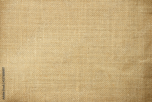Jute hessian sackcloth natural linen texture, light fabric background close up
