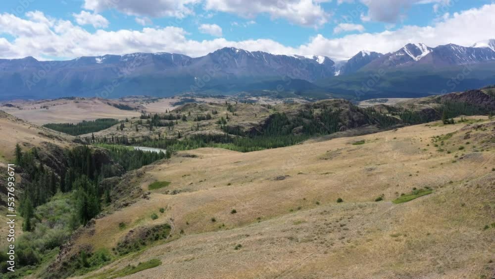 Aerial video of hills and Altai mountains in Kurai area with North Chuisky Ridge on background. Aerial video of hills and Altai mountains in Kurai area with North Chuisky Ridge on background.