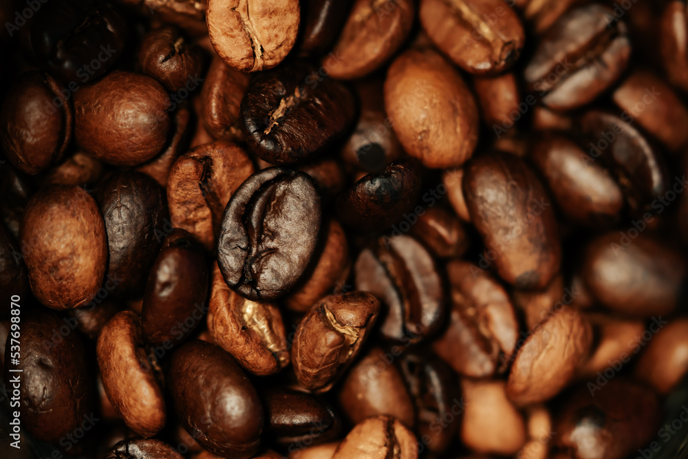 Brown Roasted Coffee Beans Closeup on the table Brown Roasted Coffee Beans Closeup on the table