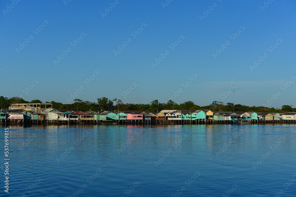 The colorful stilt village of Buena Vista, Beni Department, Bolivia, seen from the town of Costa Marques, Rondonia state, Brazil, just across the Guaporé - Itenez river