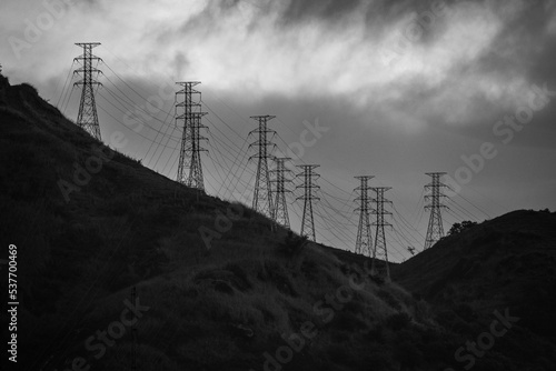 Silhouette of electrical pylons on the hills above the Zona Norte, or North Zone of Rio de Janeiro, Brazil