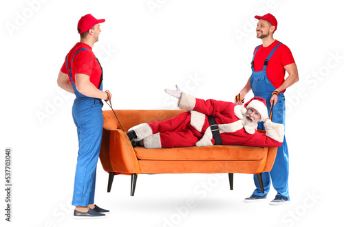 Male loaders carrying sofa ...