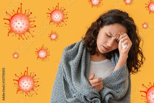 Sick woman on orange backgr...