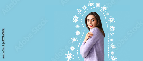 Young woman and drawn virus on light blue background with space for text. Concept of strong immunity