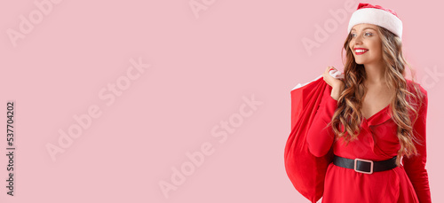 Pretty young woman in Santa...