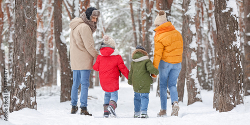 Happy family walking in for...