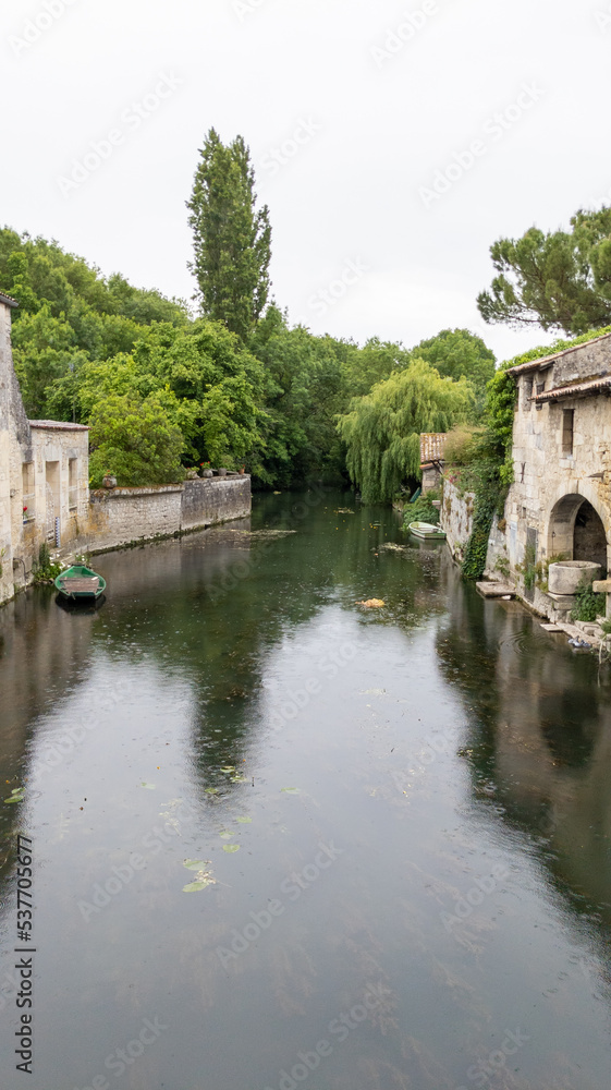 Seugne river in city center Jonzac in Charente-Maritime france Seugne river in city center Jonzac in Charente-Maritime france