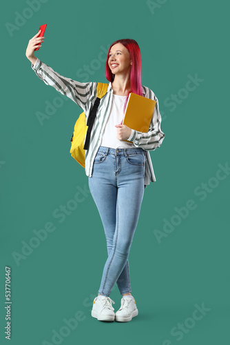 Young female student with b...